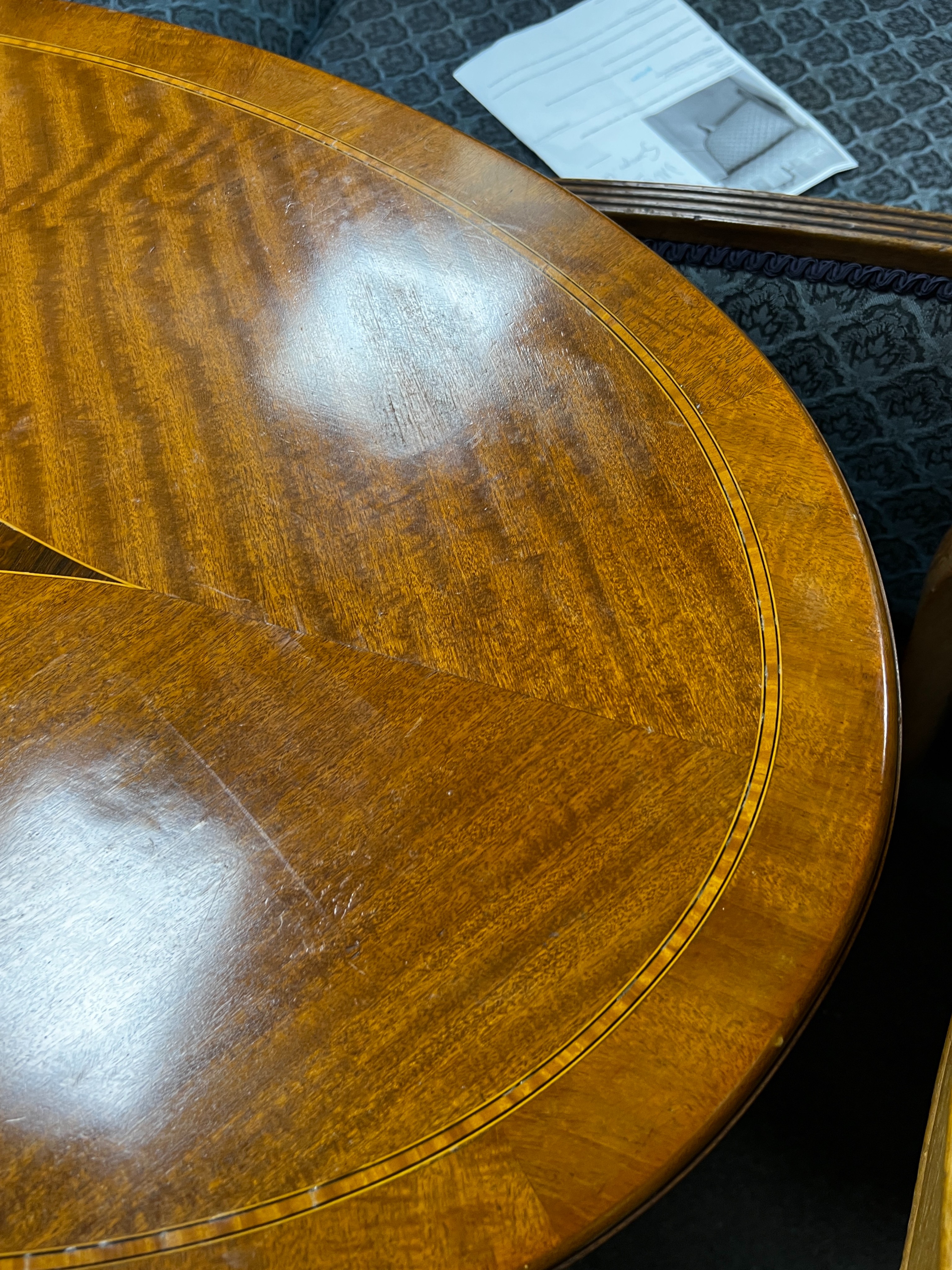 An Edwardian satinwood banded oval satinwood two tier centre table, width 98cm, depth 60cm, height 73cm